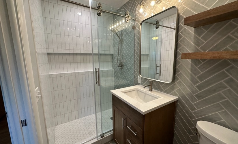 This bathroom located in Ann Arbor uses DalTile,Delta,Hardware Resources,Kohler,Quartz,Showplace Cabinets,Virginia Tile